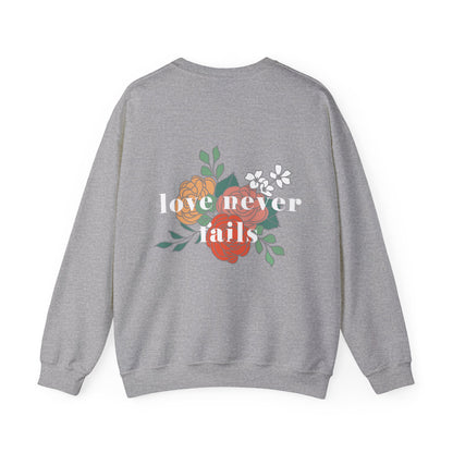 LOVE NEVER FAILS CREWNECK