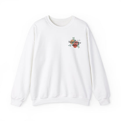 LOVE NEVER FAILS CREWNECK