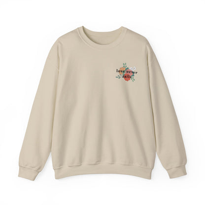 LOVE NEVER FAILS CREWNECK